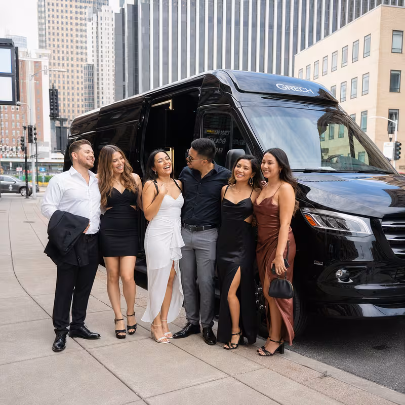 Group boarding a white charter bus for Bachelor & Bachelorette Transportation transportation in Pittsburgh