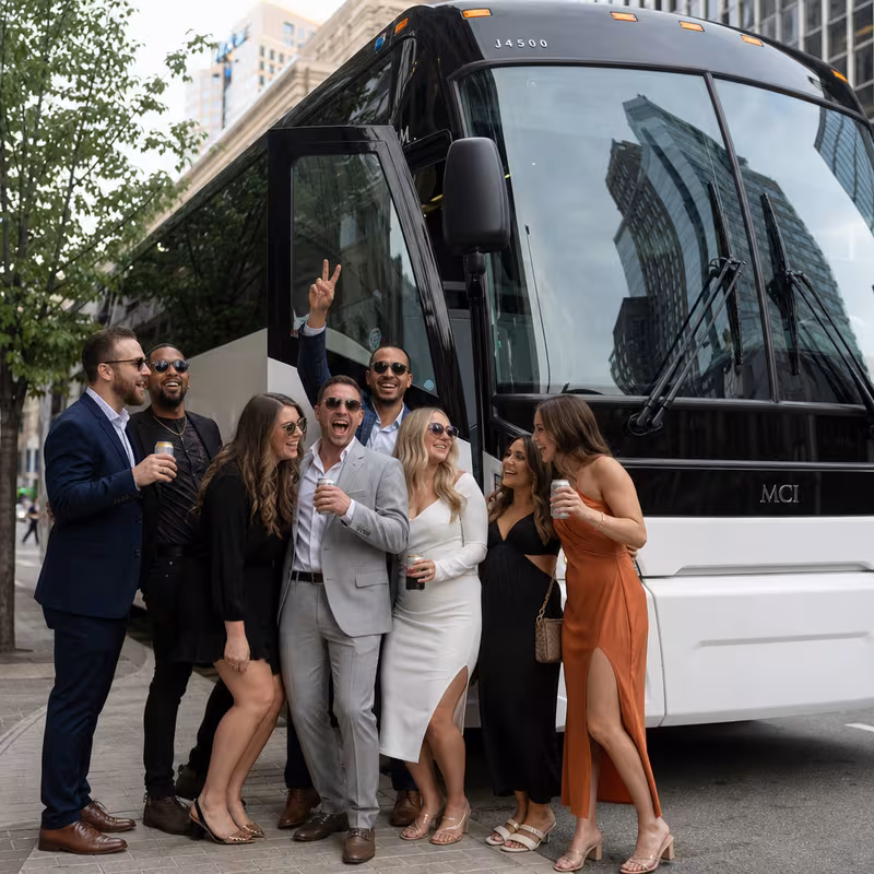 Passengers loading luggage while boarding an Pittsburgh group shuttle