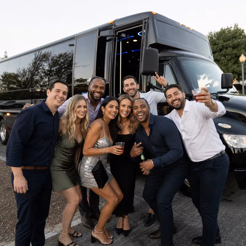 Group boarding a white charter bus for Birthday Transportation transportation in Pittsburgh