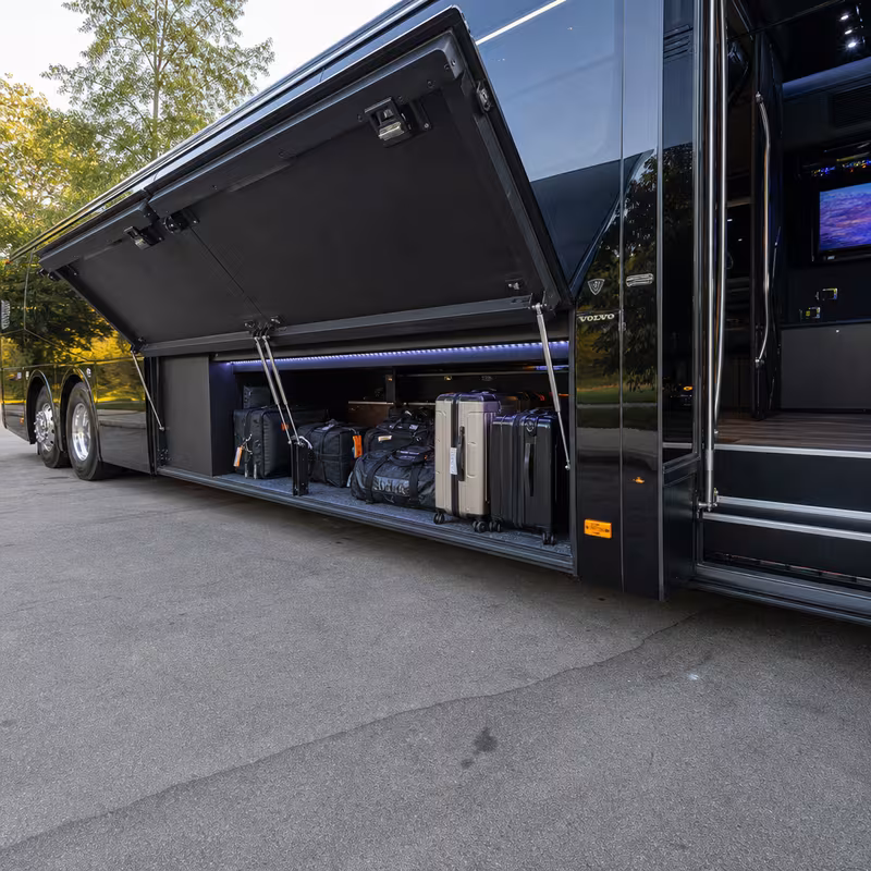 Party bus interior with wraparound leather seating and LED lighting in Pittsburgh