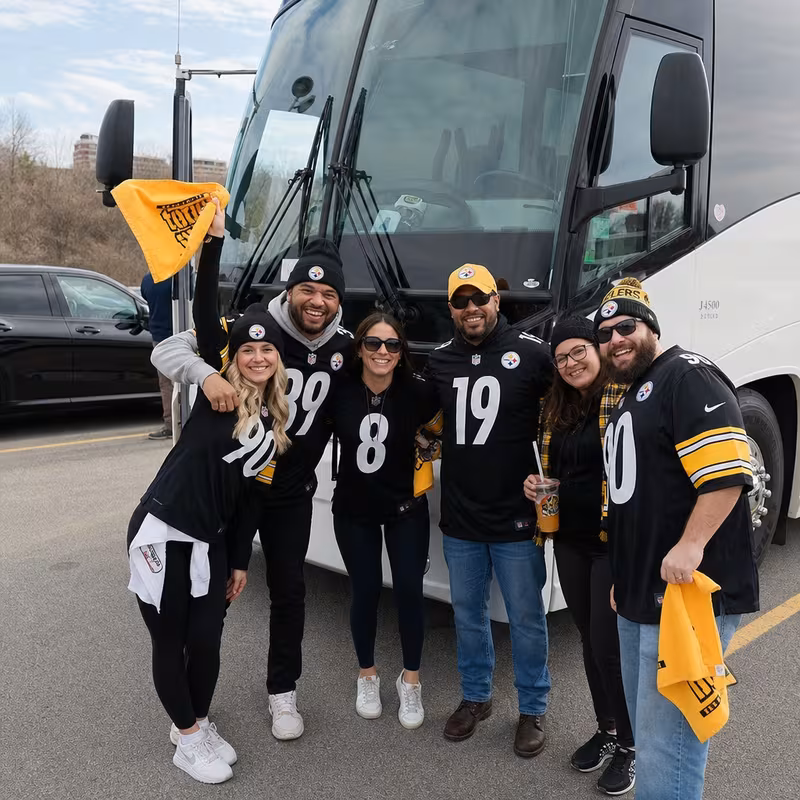 Passengers loading luggage while boarding an Pittsburgh group shuttle