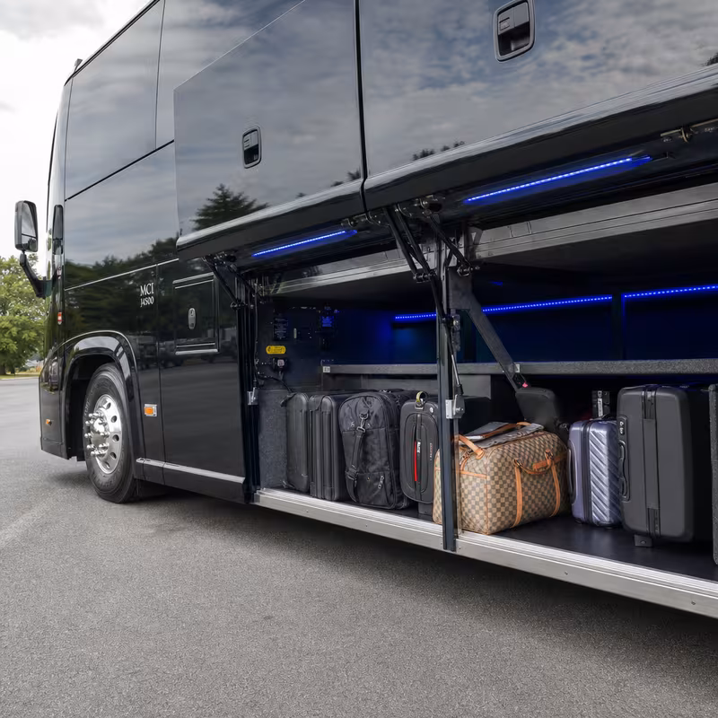 Party bus interior with wraparound leather seating and LED lighting in Pittsburgh