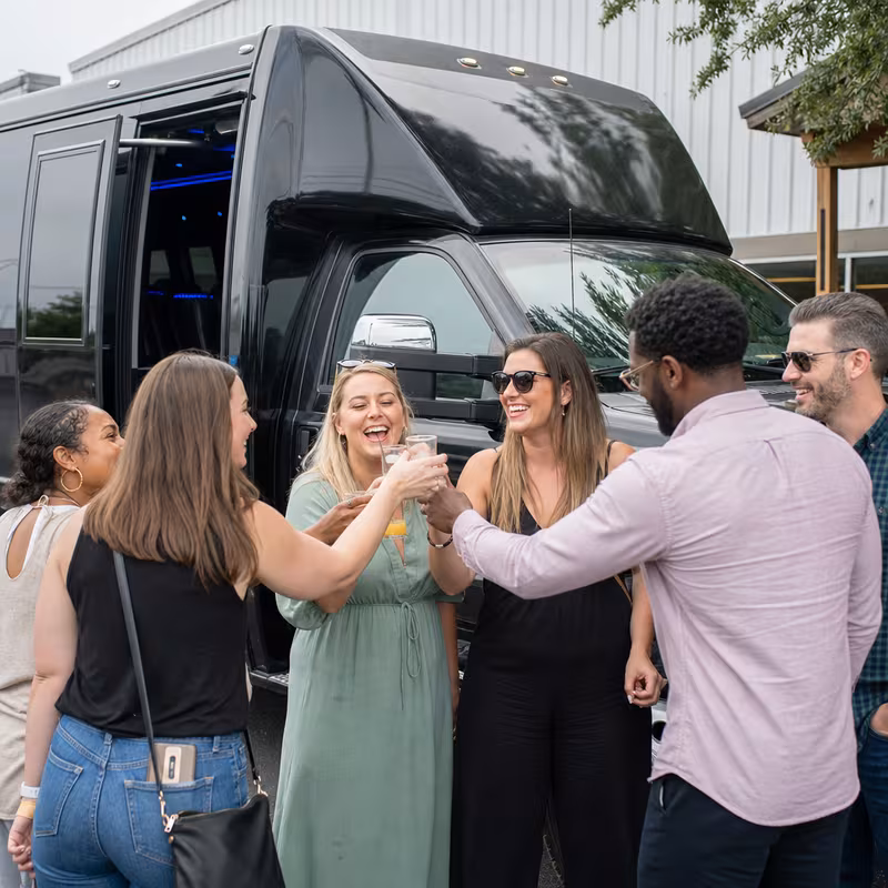 Passengers loading luggage while boarding an Pittsburgh group shuttle